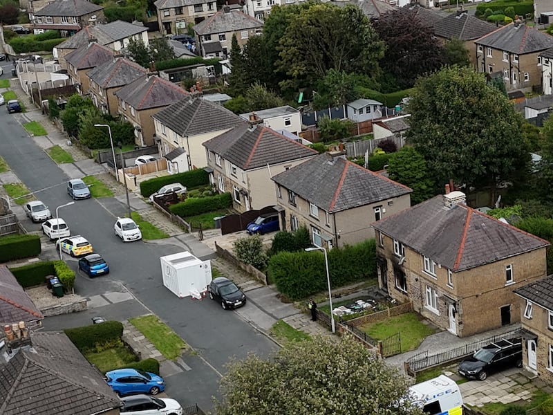 Emergency services in Westbury Road, Bradford, following a house fire