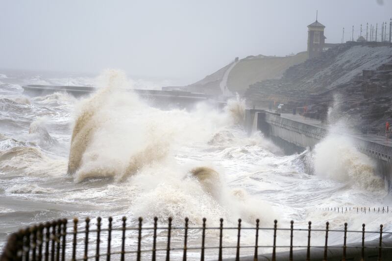 Waves break on the seafront in Blackpool, as snow, rain and wind warnings are in force and are expected to cause travel issues across the country