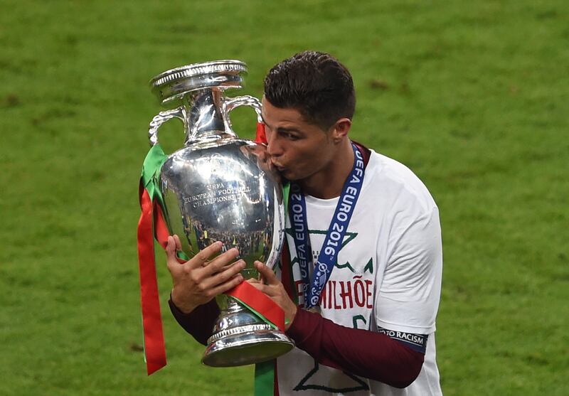 Cristiano Ronaldo holds the European Championship trophy after Portugal won Euro 2016 in France