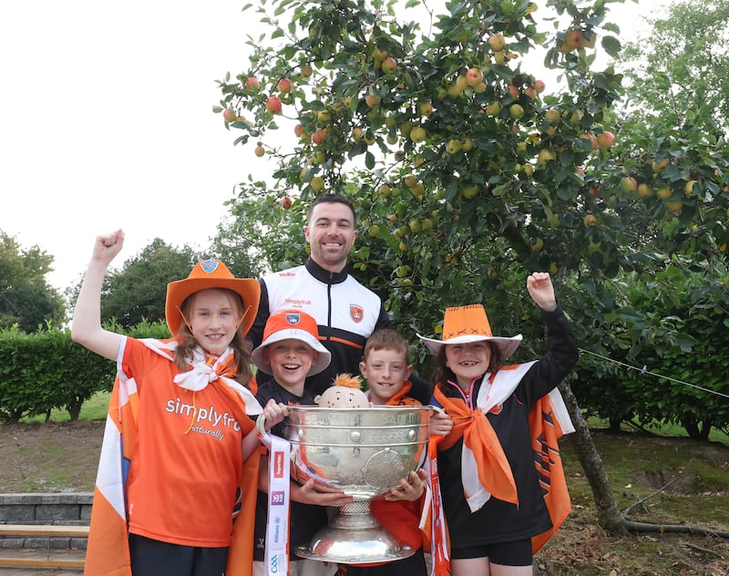 Armagh Captain Aidan Forker with pupils from L-R Molly O'Riordan, Conor McGahan, Daniel Crudden, and Blathaid Cahill as  Sam Maguire visits Our Lady’s Primary School Tullysaran  on Thursday.
PICTURE COLM LENAGHAN