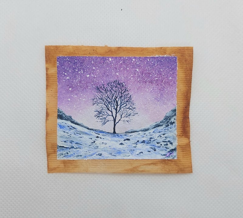 The Sycamore Gap tree painted in winter on a used tea bag