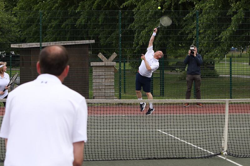 Sir Ed Davey plays tennis on the campaign trail in Newbury, Berkshire