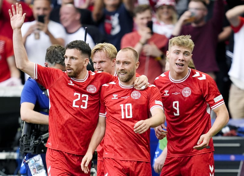 Christian Eriksen (centre) celebrates with team-mates after scoring for Denmark