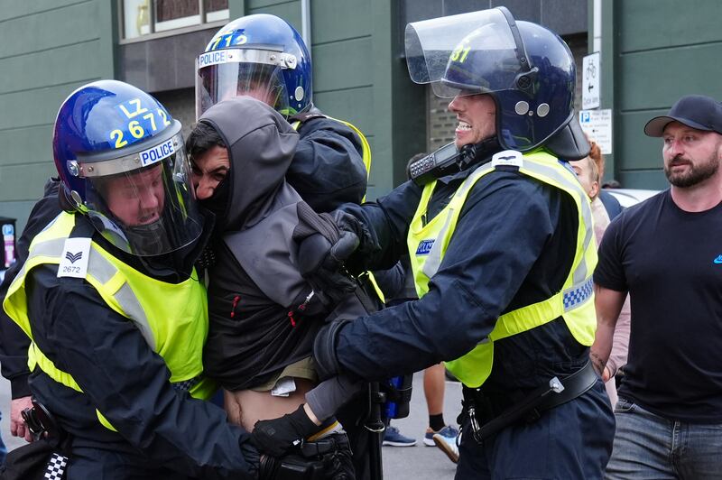 Police detain a man during an anti-immigration protest in Middlesbrough