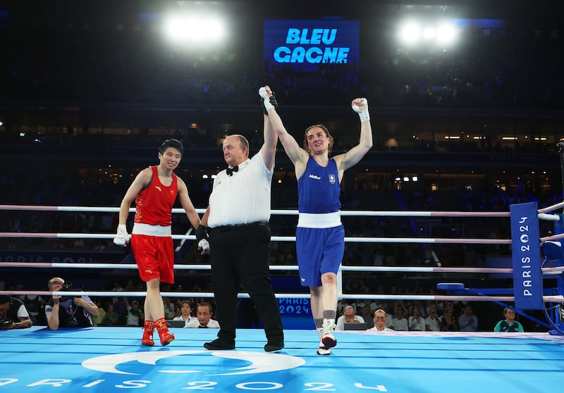 Kellie Harrington's hand is raised after Monday night's Olympic final victory over China's Wenlu Yang. Photo by Richard Pelham/Getty Images