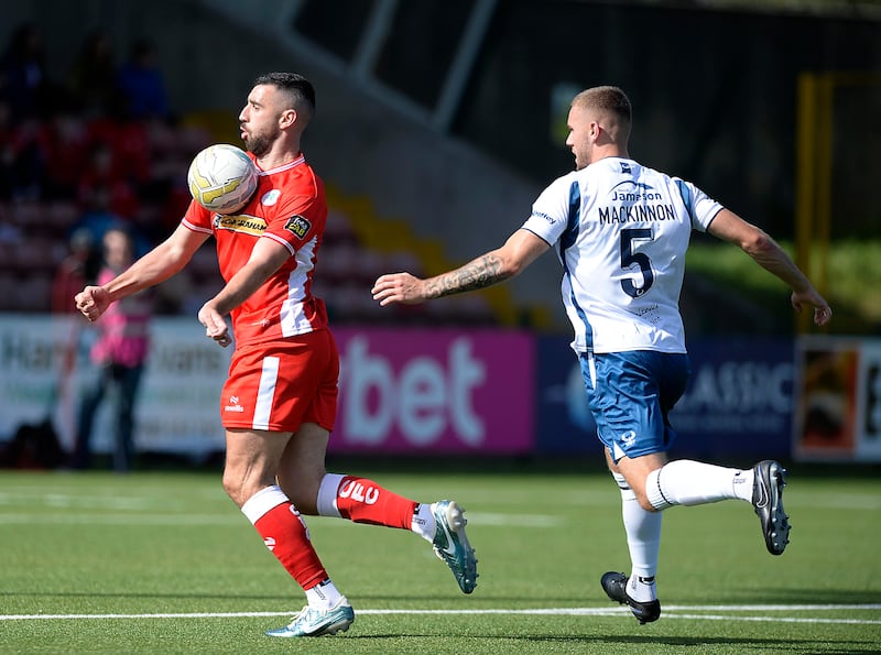 Cliftonville's Joe Gormley chests the ball as he takes on Portadown defender Lewis MacKinnon.