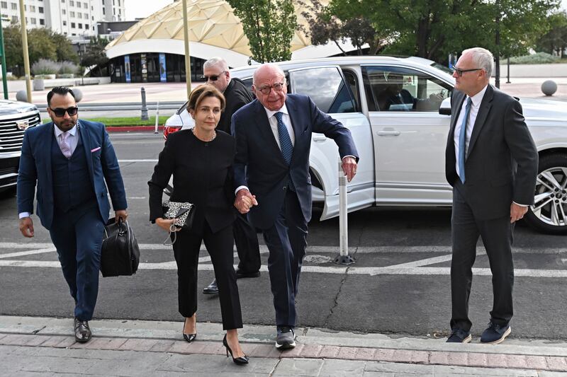 Rupert Murdoch, centre, and his wife Elena Zhukova Murdoch arrive at the Second Judicial District Court in Reno, Nevada on Monday (Andy Barron/AP)