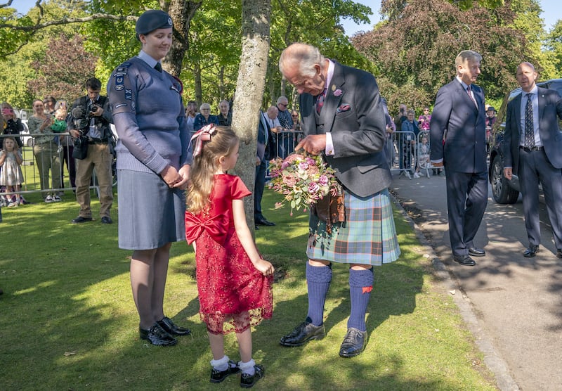 The King receives flowers from Charlotte Keith, 5