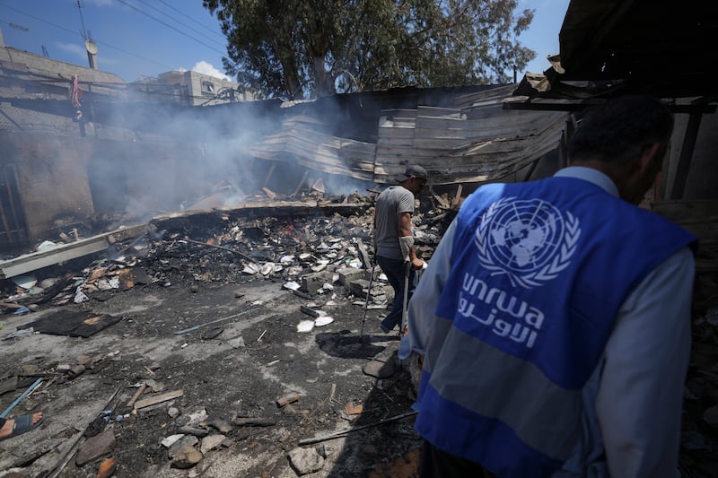 The scene after an Israeli strike on a school run by UNRWA in Nuseirat, Gaza (Abdel Kareem Hana/AP)