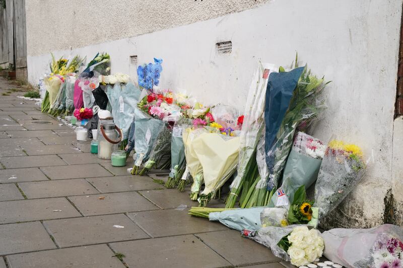 Flowers were left at the scene in Kirkstall Gardens