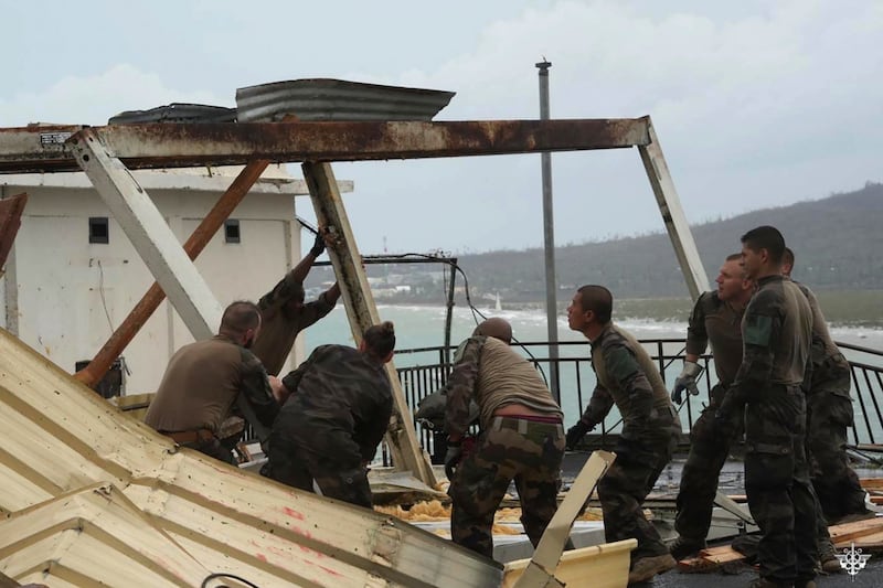 Soldiers at work to restore a building in the French territory of Mayotte in the Indian Ocean after Cyclone Chido (Etat Major des Armees via AP)