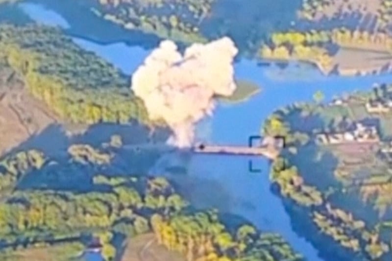 Smoke billows in an image said by Ukraine to show the destruction of a key bridge in Russia’s Kursk region (Ukrainian Armed Forces/AP)