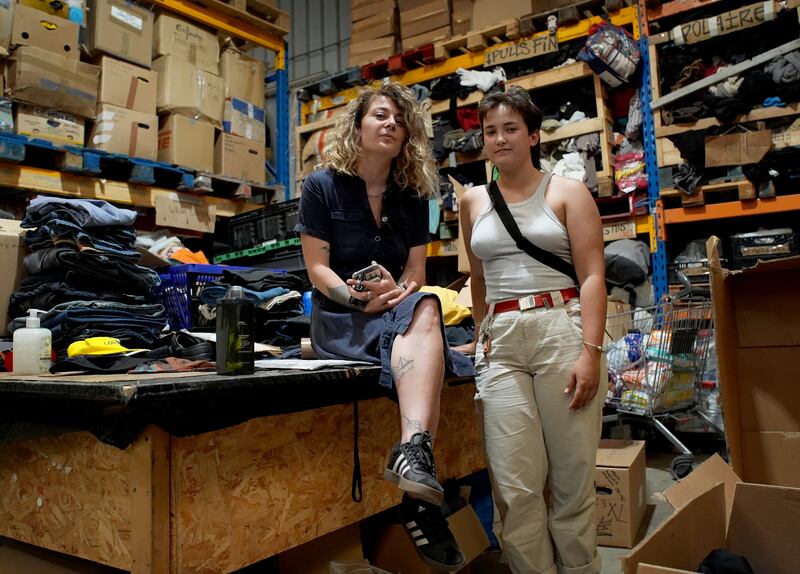 Flore Judet (left), programme and communications co-ordinator of Auberge des Migrants, with Angele Vettorello, co-ordinator at Utopia 56, at the base in Calais, France, for charities that support the welfare of migrants