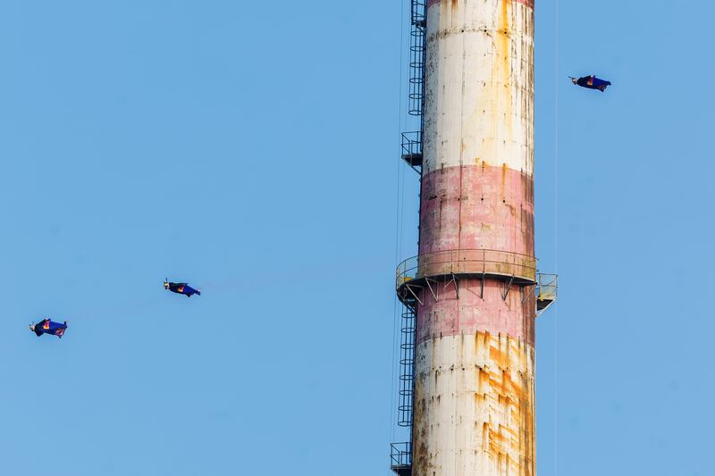 Red Bull skydivers Marco Fürst, Marco Waltenspiel and Max Manow fly through Dublin’s iconic Poolbeg Chimneys