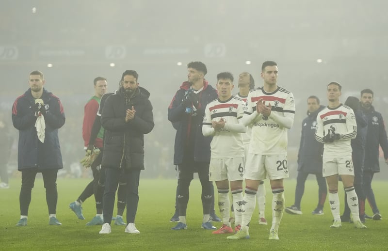 Ruben Amorim (second left) and his players applaud the fans