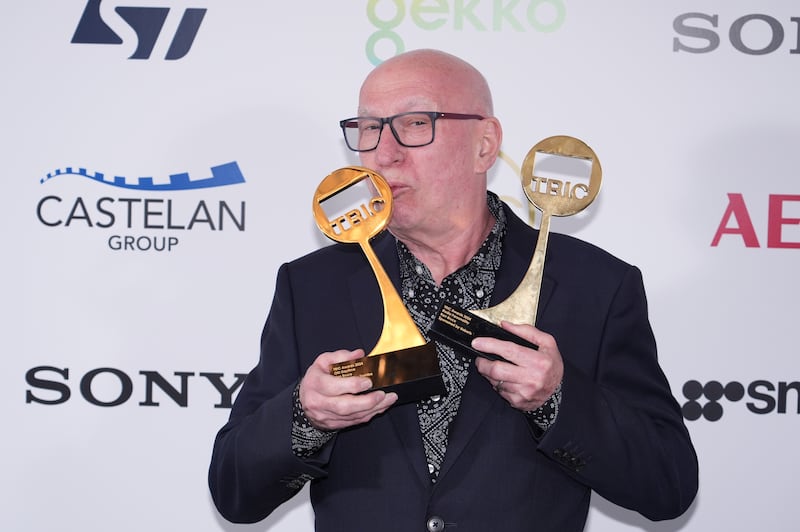 Ken Bruce with his two awards at the Tric ceremony
