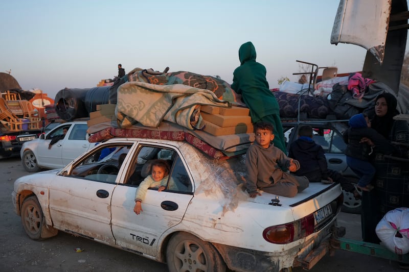 Displaced Palestinians make their way from central Gaza to their homes in the northern Gaza Strip (AP Photo/Abdel Kareem Hana)