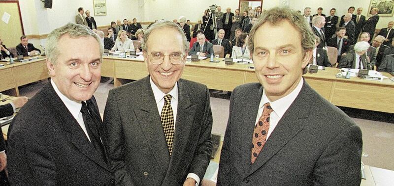 Senator George Mitchell (centre) with former British prime minister Tony Blair (right) and former taoiseach Bertie Ahern (left) after the signing of the Good Friday Agreement. Picture by Dan Chung 