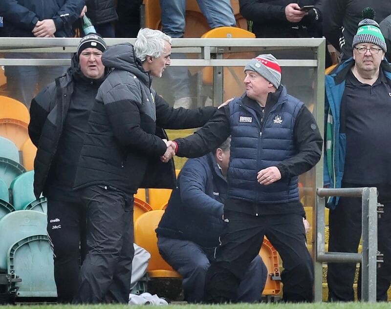 Donegal manager Jim McGuinness with Cork manager John Cleary before the National Football League Div 2 match played at Ballybofey on Sunday 28th January 2024. On the subs bench to the right seasoned players including Oisin Gallen and Michael Langan. Picture Margaret McLaughlin