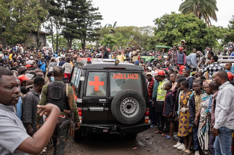 An ambulance carries victims away from the port of Goma, Democratic Republic of Congo, after a ferry carrying hundreds of people capsized (Moses Sawasawa/AP)