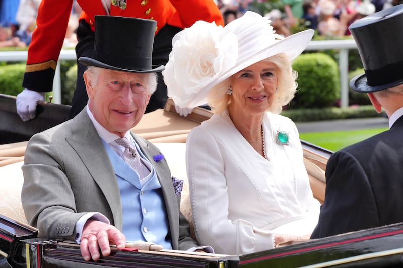 Queen Camilla sports a flourishing flower on her wide rimmed hat