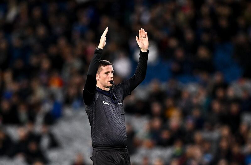 Referee Barry Tiernan signals for a two point score from outside the 40m arc during the Allianz GAA Football Interprovincial Championship Semi-Final match between Munster and Ulster at Croke Park in Dublin.