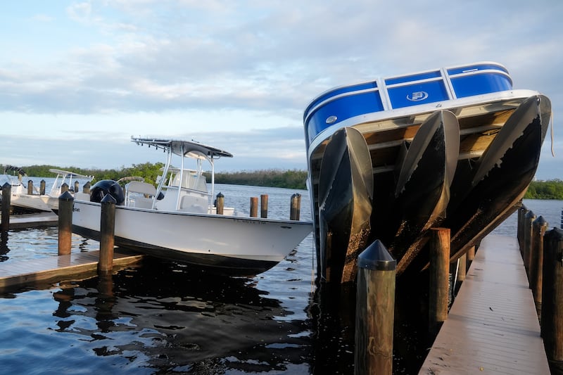 Small boats rest on a pier in Fort Myers (Marta Lavandier/AP)