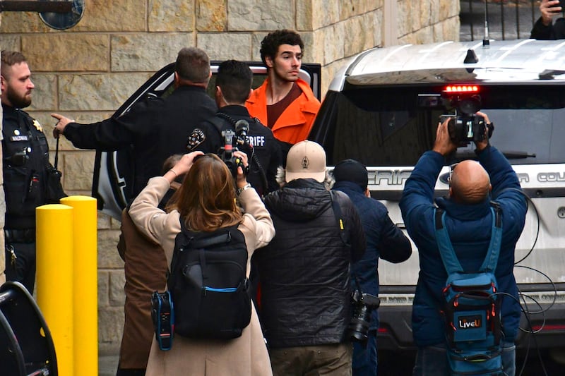 Suspect Luigi Mangione is taken into the Blair County Courthouse in Pennsylvania on Tuesday (Janet Klingbeil via AP)