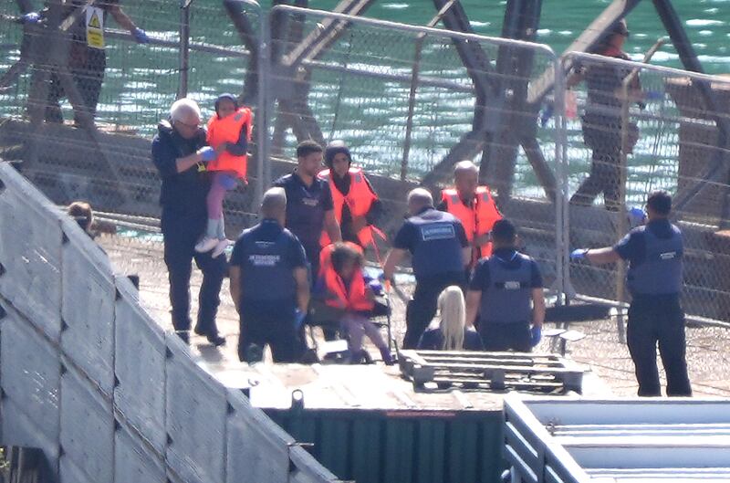 A child in a wheelchair was among a group of people believed to be migrants taken by a Border Force vessel to Dover, Kent