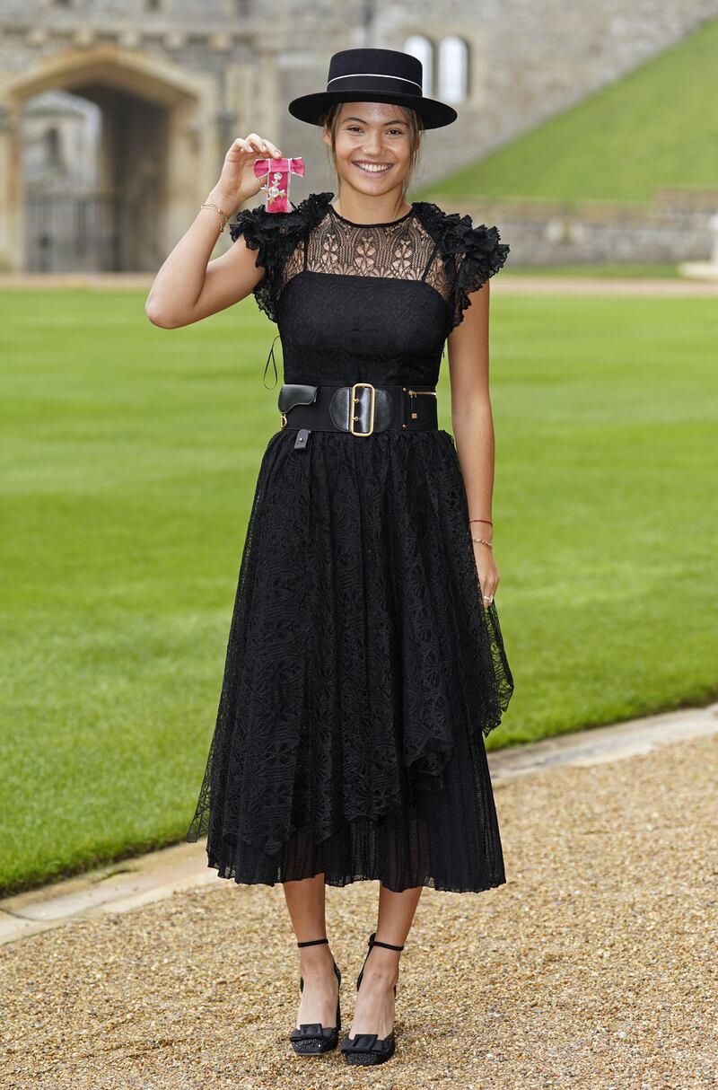 Raducanu combined classical and contemporary in a Dior dress as she collected her MBE