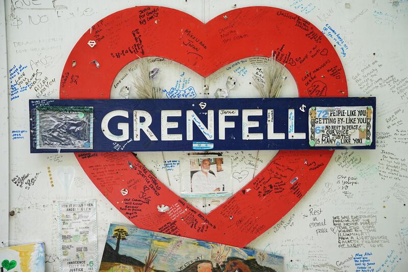 The hoarding around Grenfell Tower last month