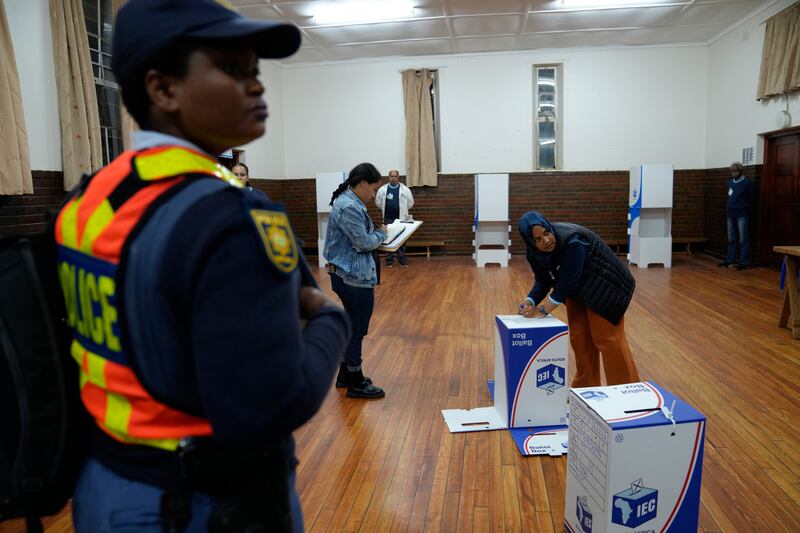 A voting official prepares a voting box at a polling station in Cape Town (Nardus Engelbrecht/AP)