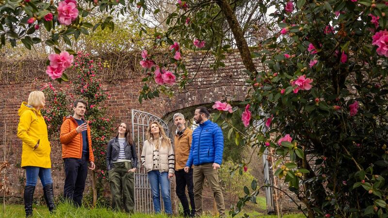 David Gilliland (second from left), delivering a tour of Brook Hall’s walled garden along the Foyle in Culmore, Derry City.