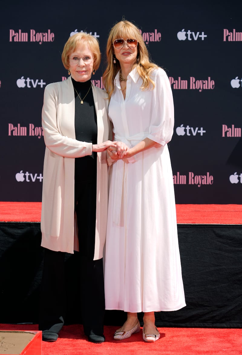 Comedian Carol Burnett, left, and actor Laura Dern pose together during a hand and footprint ceremony for Burnett at the TCL Chinese Theatre (Chris Pizzello/AP)