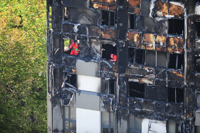 Urban search and rescue officers from London Fire Brigade inside Grenfell Tower