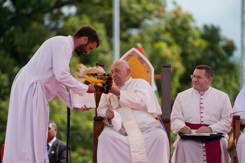 The Pope talks with Father Martin Prado, a missionary from the Institute of the Incarnate Word, left, during a meeting with the faithful in Vanimo, Papua New Guinea (Gregorio Borgia/AP)