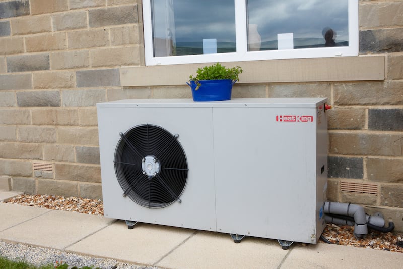 An air source heat pump outside a house