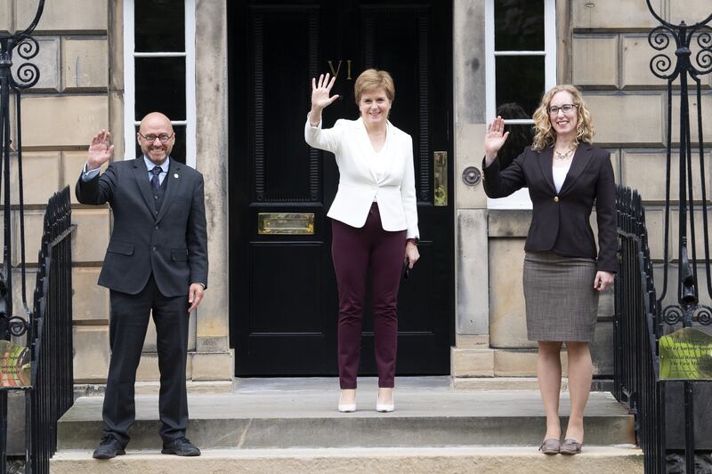 Nicola Sturgeon (centre) brought the Scottish Greens into government when she was first minister, with Patrick Harvie (left) and Lorna Salter (right) made junior ministers as a result of the Bute House Agreement.