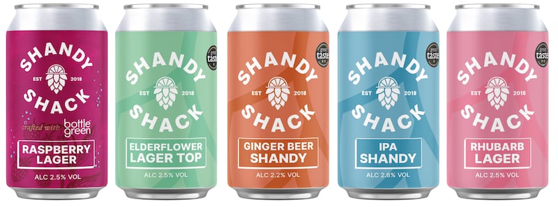 Five cans with Shandy Shack branding.