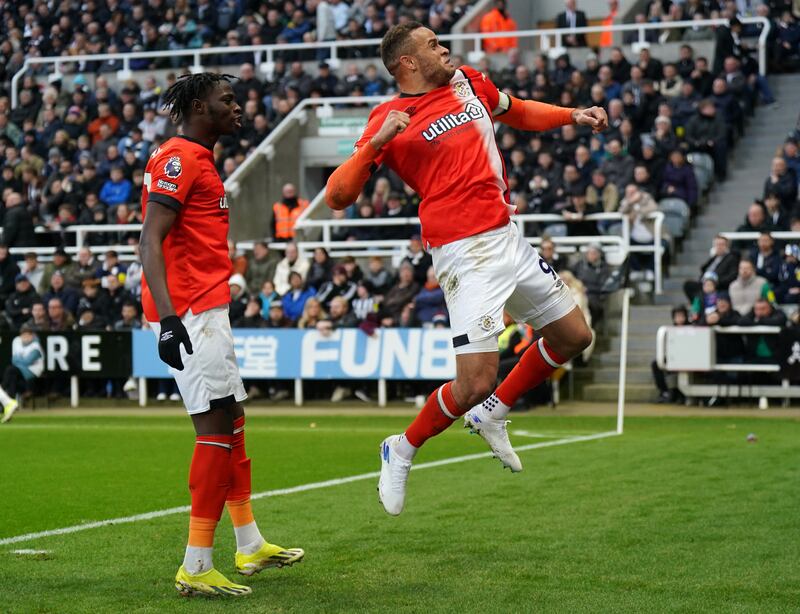 Goals galore as Luton’s Carlton Morris (right) celebrates with team-mate Elijah Adebayo after scoring his side’s third goal