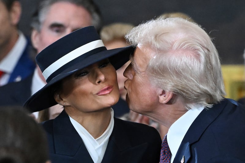 Donald Trump attempts to kiss Melania Trump before the 60th Presidential Inauguration (Saul Loeb/Pool photo via AP)