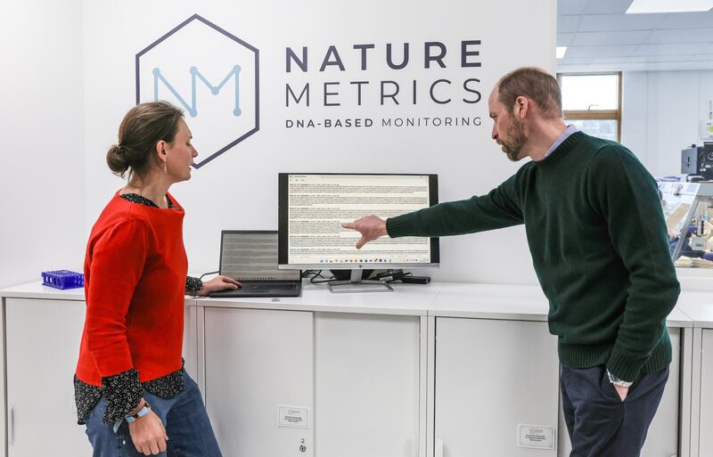 The Prince of Wales talks with Dr Kat Bruce founder of NatureMetrics. Richard Pohle/The Times