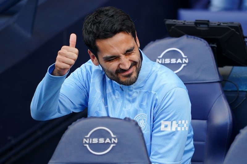 Manchester City’s Ilkay Gundogan gestures on the bench ahead of the Premier League match against Ipswich .