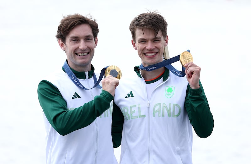 Olympics gold medallists Fintan McCarthy and Paul O'Donovan celebrate after Friday's final in Paris. Picture by Alex Davidson/Getty Images