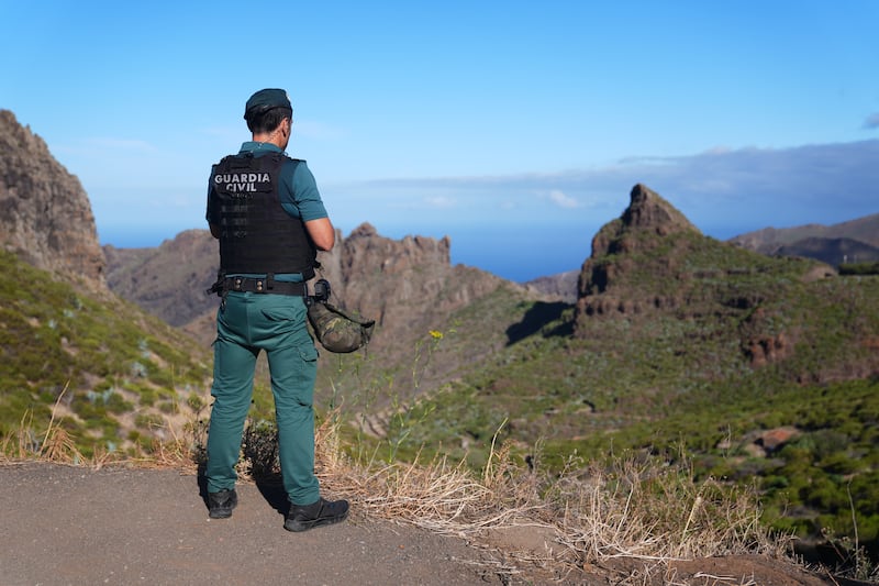 A police officer looks over terrain near Masca in Tenerife