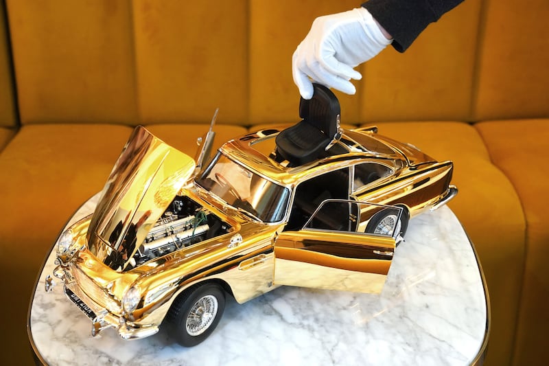 The ejector seat on a 24-carat gold-plated model of James Bond’s Goldfinger Aston Martin DB5