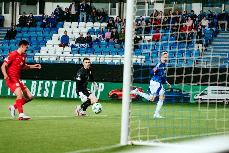 Larne’s Shaun Want tools the ball off the line with Rohan Ferguson beaten during this evenings game