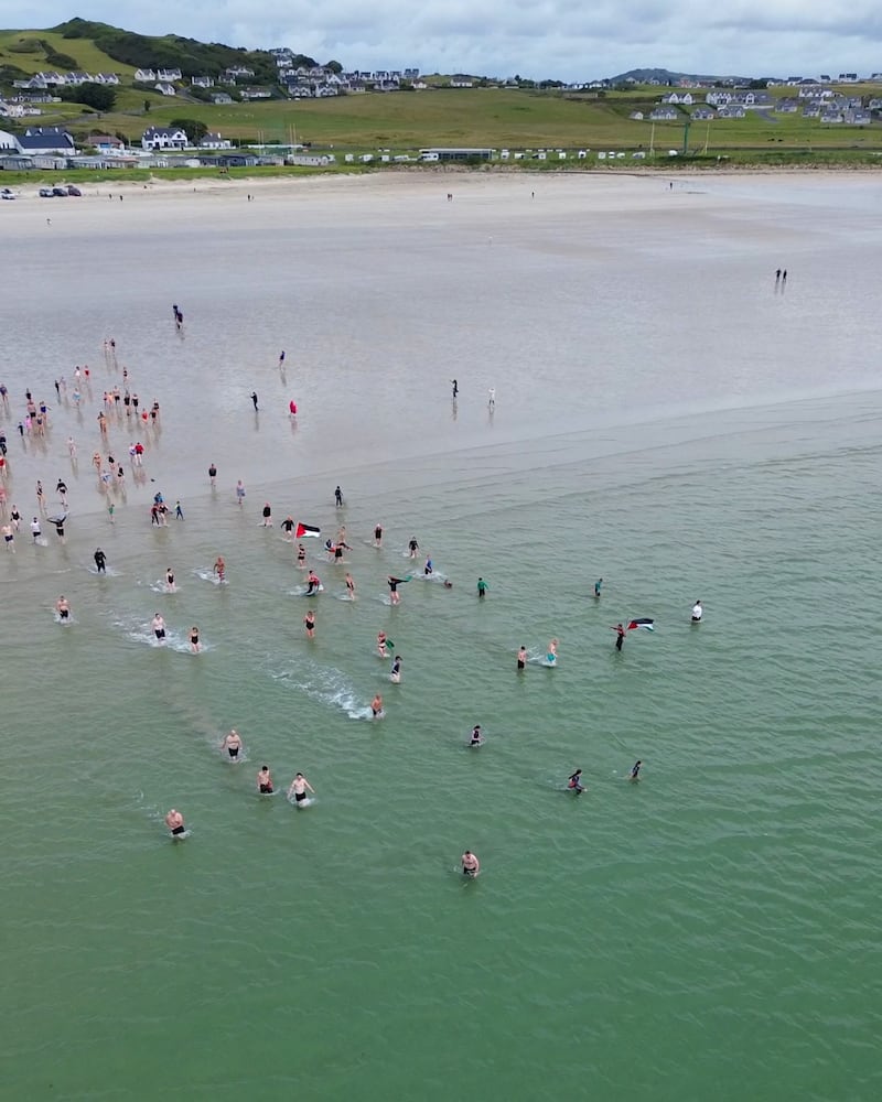 150 swimmers took to the sea, watched by their onshore supporters, in aid of Fund a Food Drop and Medical Aid for Palestinians. PHOTOGRAPH: PATRICK BROWNE