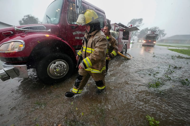 Morgan City firefighters respond to a home fire during Hurricane Francine in Morgan City, Louisiana (Gerald Herbert/AP)