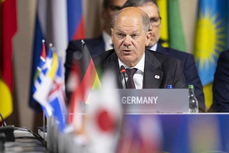Germany’s Chancellor Olaf Scholz speaks during the opening plenary session of the Summit on Peace in Ukraine, in Obburgen, Switzerland (Urs Flueeler/AP)